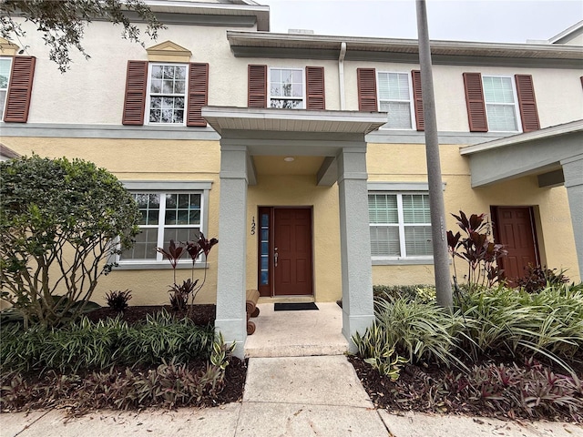 8271 Maritime Flag St Unit 125, Windermere, FL 34786 - view of exterior entry featuring stucco siding