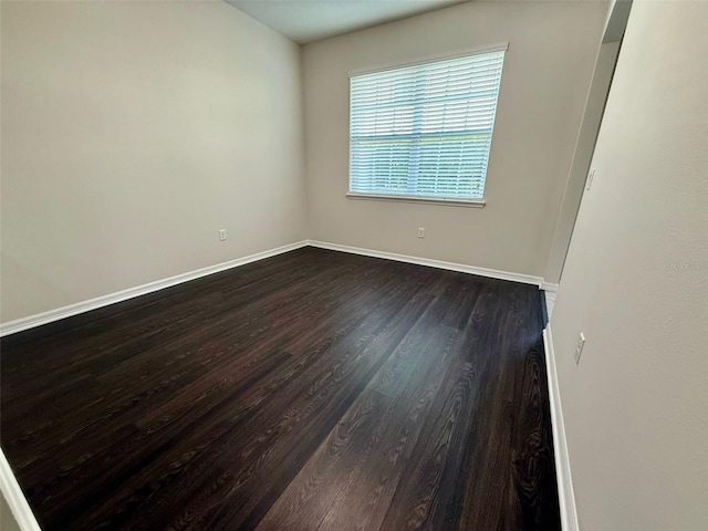 8271 Maritime Flag St Unit 125, Windermere, FL 34786 - unfurnished room featuring baseboards and dark wood finished floors