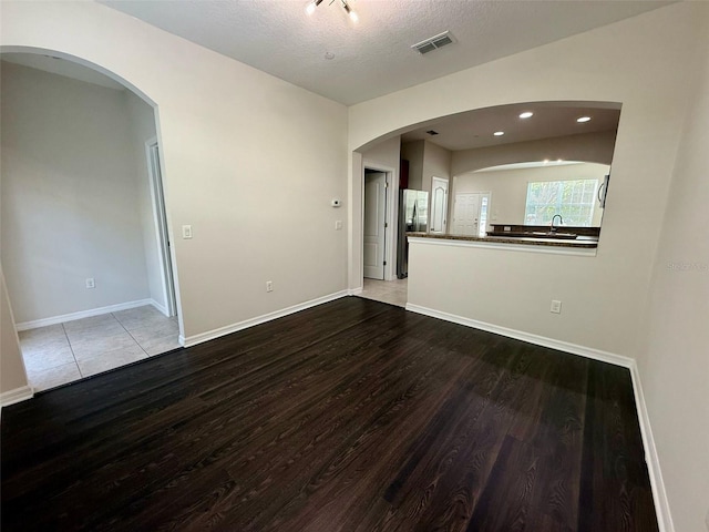 8271 Maritime Flag St Unit 125, Windermere, FL 34786 - unfurnished room with baseboards, recessed lighting, a textured ceiling, visible vents, and wood finished floors