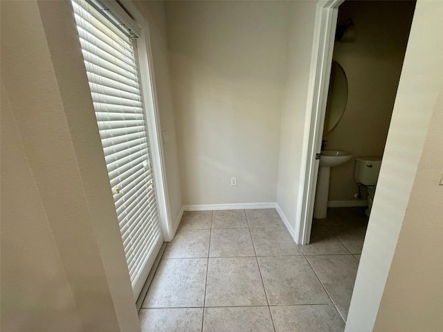8271 Maritime Flag St Unit 125, Windermere, FL 34786 - hallway featuring light tile patterned flooring and baseboards