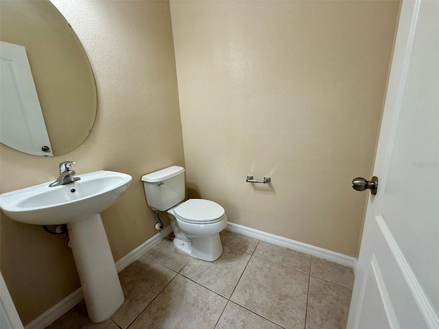 8271 Maritime Flag St Unit 125, Windermere, FL 34786 - bathroom with toilet, baseboards, and tile patterned flooring