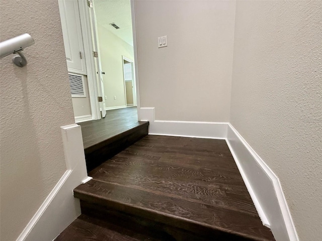 8271 Maritime Flag St Unit 125, Windermere, FL 34786 - stairway with wood finished floors, a textured wall, and visible vents