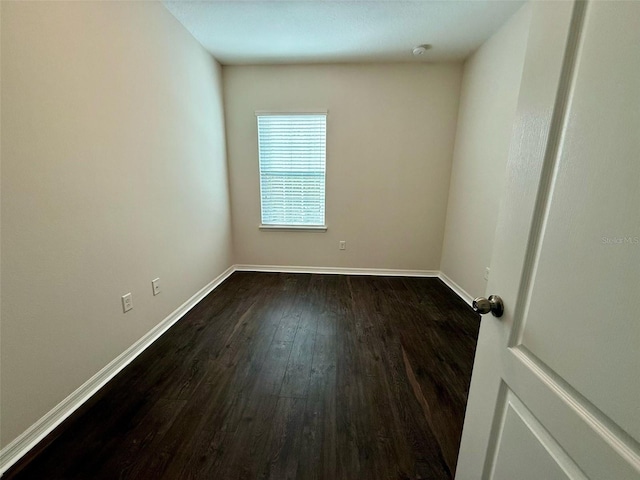 8271 Maritime Flag St Unit 125, Windermere, FL 34786 - unfurnished room with baseboards and dark wood finished floors