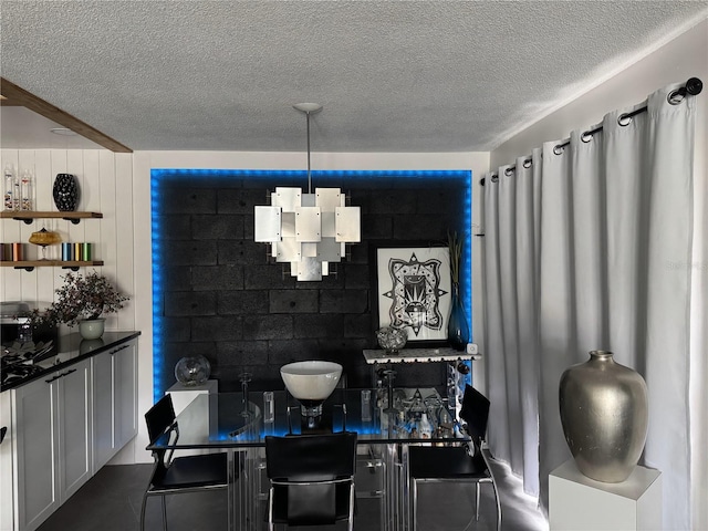 dining room featuring a textured ceiling
