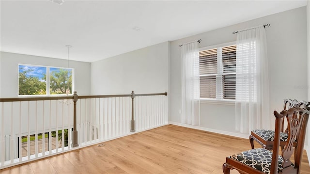 sitting room featuring baseboards and wood finished floors