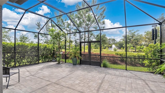 view of patio / terrace featuring glass enclosure