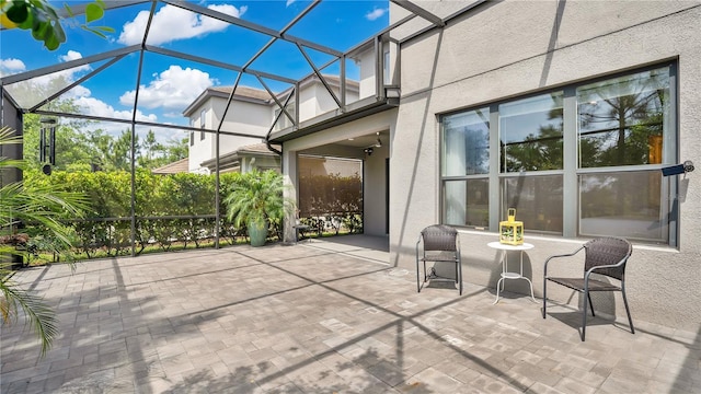 view of patio with a lanai