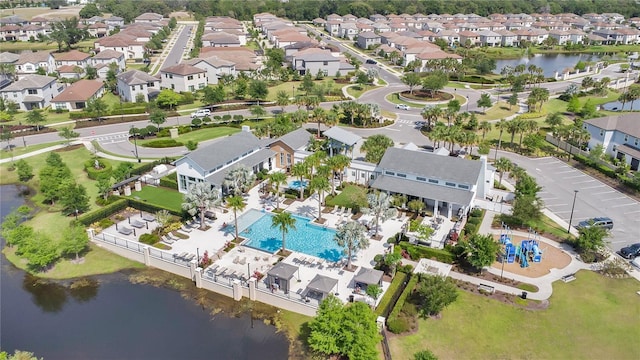 birds eye view of property featuring a water view and a residential view