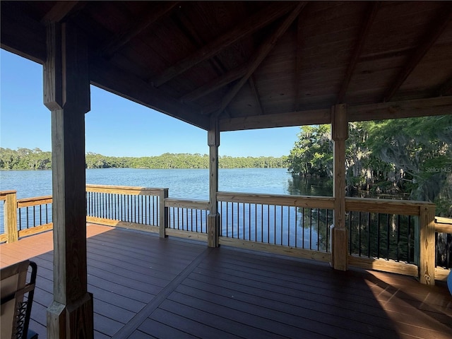view of dock featuring a deck with water view