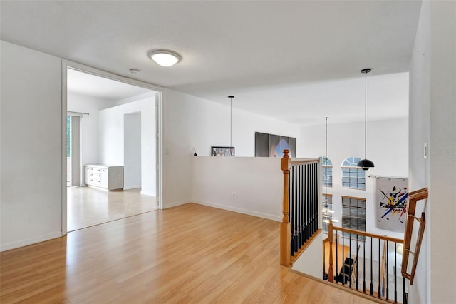 spare room with wood finished floors and baseboards
