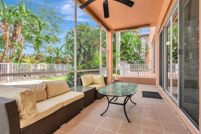 sunroom / solarium with an outdoor hangout area and a ceiling fan