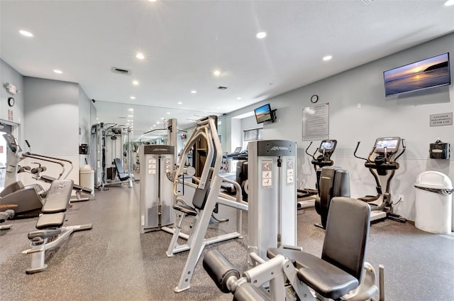 exercise room with visible vents and recessed lighting
