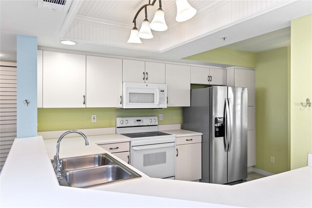 2700 N Peninsula Ave Unit 215, New Smyrna Beach, FL 32169 - kitchen featuring a sink, visible vents, white cabinetry, white appliances, and light countertops