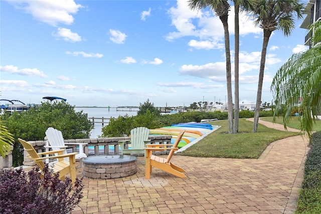 2700 N Peninsula Ave Unit 215, New Smyrna Beach, FL 32169 - view of patio / terrace featuring a fire pit and a water view