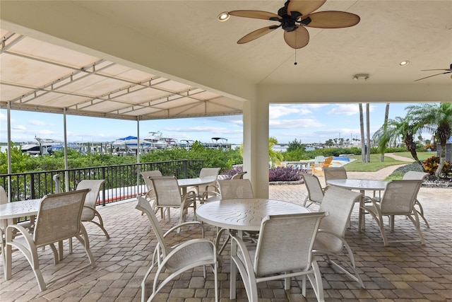 2700 N Peninsula Ave Unit 215, New Smyrna Beach, FL 32169 - view of patio / terrace with outdoor dining area and ceiling fan