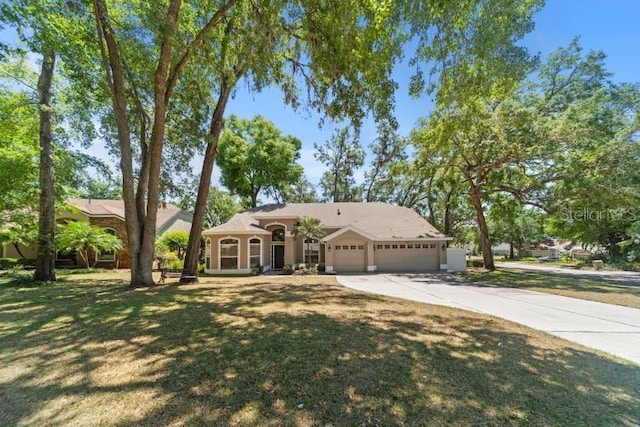 2082 Nexus Ct, Apopka, FL 32712 - ranch-style house featuring driveway, a garage, a front lawn, and stucco siding