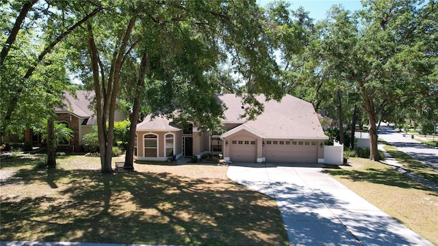 2082 Nexus Ct, Apopka, FL 32712 - view of front of home with an attached garage and concrete driveway