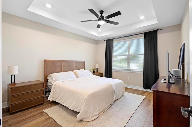 10215 Park Estates Ave, Orlando, FL 32836 - bedroom featuring recessed lighting, a raised ceiling, light wood-type flooring, baseboards, and ceiling fan