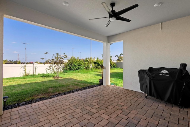 10215 Park Estates Ave, Orlando, FL 32836 - view of patio / terrace with grilling area, fence, and ceiling fan