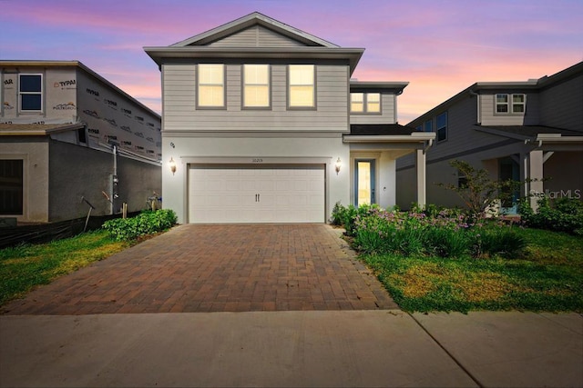 10215 Park Estates Ave, Orlando, FL 32836 - traditional-style house with stucco siding, an attached garage, and decorative driveway