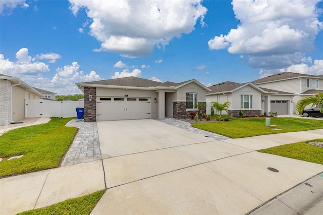 236 Pink Ibis Bnd, Saint Cloud, FL 34772 - ranch-style house with a gate, a front lawn, driveway, an attached garage, and fence