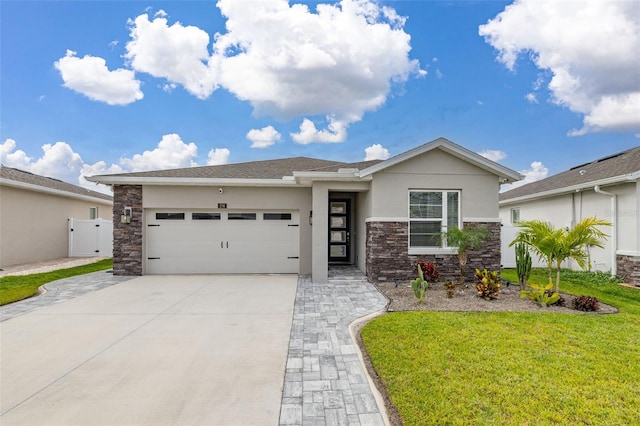 236 Pink Ibis Bnd, Saint Cloud, FL 34772 - prairie-style home featuring a front lawn, driveway, stone siding, a garage, and stucco siding