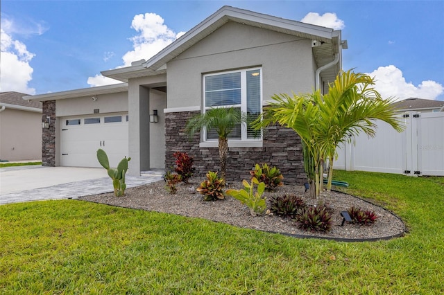 236 Pink Ibis Bnd, Saint Cloud, FL 34772 - view of front of house with fence, stucco siding, driveway, a front yard, and a garage