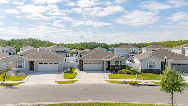 236 Pink Ibis Bnd, Saint Cloud, FL 34772 - view of front facade with an attached garage, stone siding, a residential view, and concrete driveway