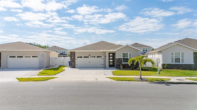 236 Pink Ibis Bnd, Saint Cloud, FL 34772 - view of front of property with stone siding, driveway, fence, and a front yard