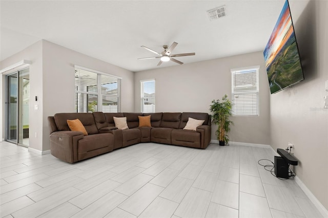 236 Pink Ibis Bnd, Saint Cloud, FL 34772 - living area with visible vents, a ceiling fan, and baseboards