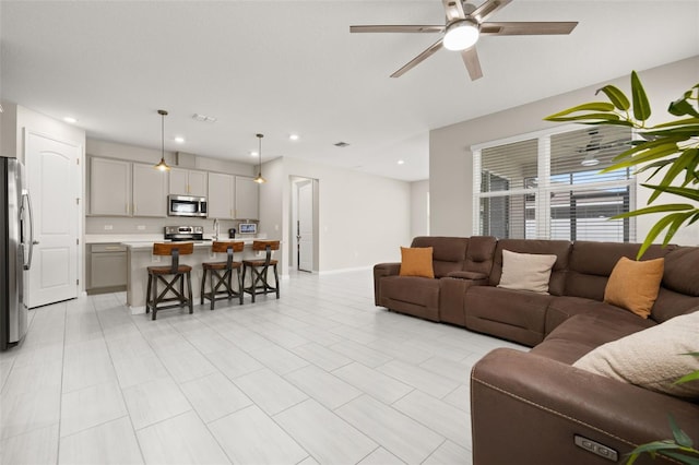 236 Pink Ibis Bnd, Saint Cloud, FL 34772 - living room with a ceiling fan, baseboards, and recessed lighting