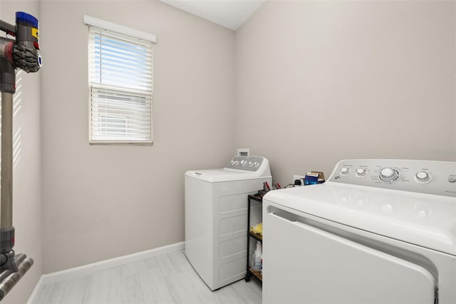 236 Pink Ibis Bnd, Saint Cloud, FL 34772 - laundry area with separate washer and dryer, baseboards, and laundry area