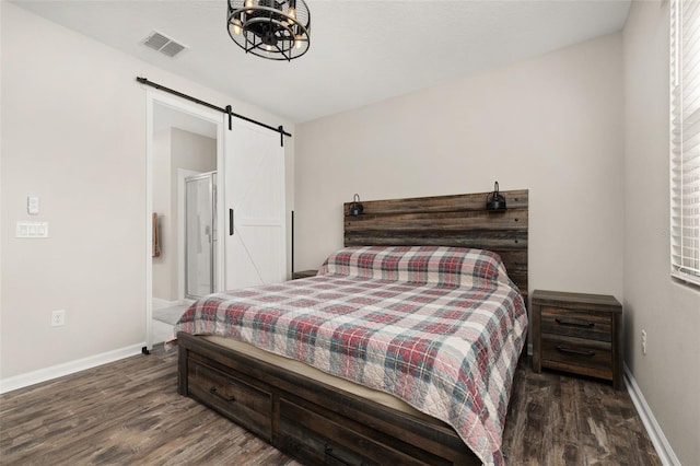 236 Pink Ibis Bnd, Saint Cloud, FL 34772 - bedroom with a barn door, wood finished floors, visible vents, baseboards, and a chandelier