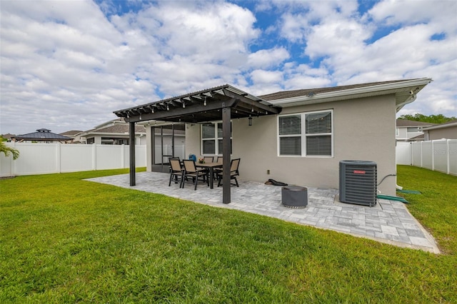 236 Pink Ibis Bnd, Saint Cloud, FL 34772 - back of property featuring a fenced backyard, a yard, central AC, stucco siding, and a patio