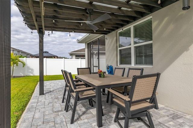 236 Pink Ibis Bnd, Saint Cloud, FL 34772 - view of patio featuring fence, outdoor dining space, and a sunroom