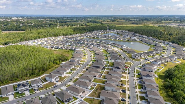 236 Pink Ibis Bnd, Saint Cloud, FL 34772 - birds eye view of property featuring a view of trees and a residential view
