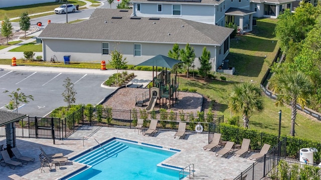 236 Pink Ibis Bnd, Saint Cloud, FL 34772 - community pool featuring fence, playground community, and a patio