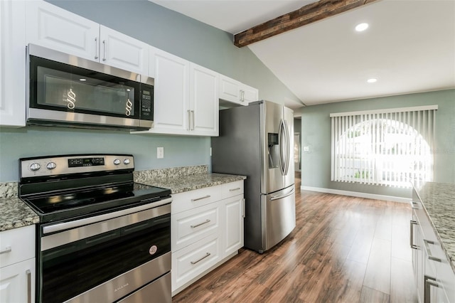 10237 Bannock St, Spring Hill, FL 34608 - kitchen featuring dark wood finished floors, white cabinetry, light stone countertops, and stainless steel appliances