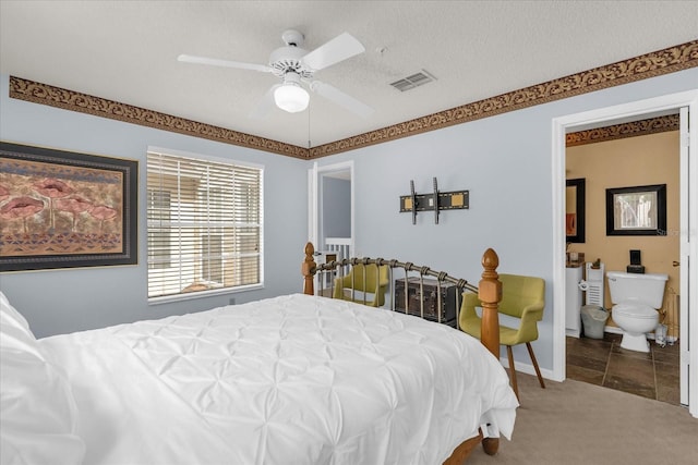 bedroom featuring baseboards, visible vents, carpet, a ceiling fan, and connected bathroom
