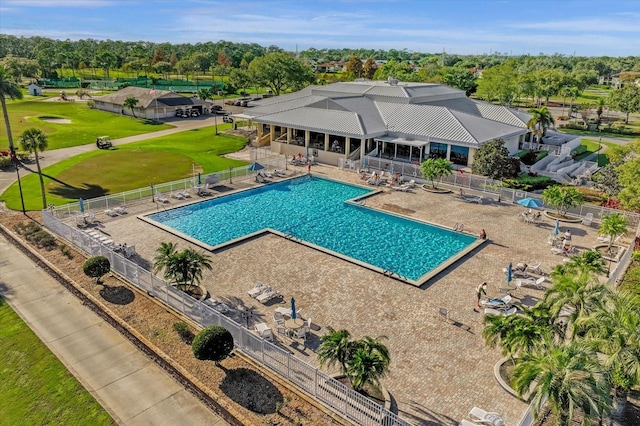 pool with fence and a patio area