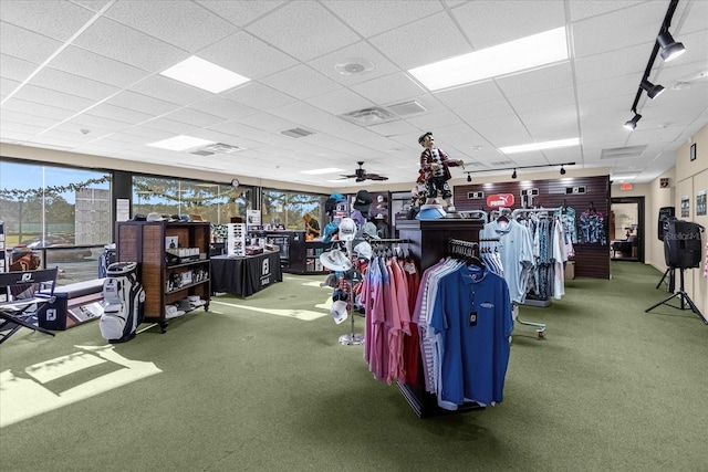 gym with ceiling fan, carpet flooring, a drop ceiling, and visible vents