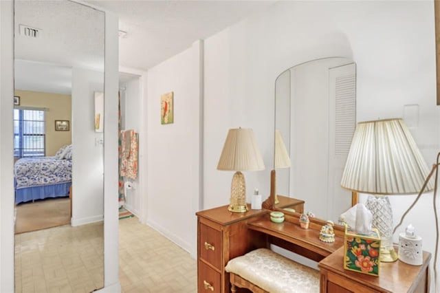 interior space featuring baseboards and visible vents