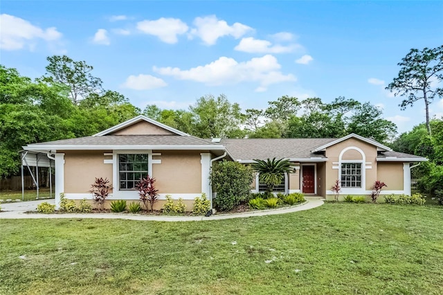 single story home featuring stucco siding, a front lawn, and a shingled roof