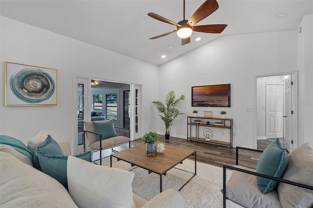 living room with high vaulted ceiling, wood finished floors, ceiling fan, baseboards, and recessed lighting