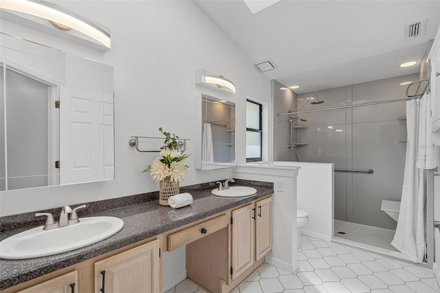 bathroom featuring visible vents, a sink, a shower with shower curtain, and double vanity