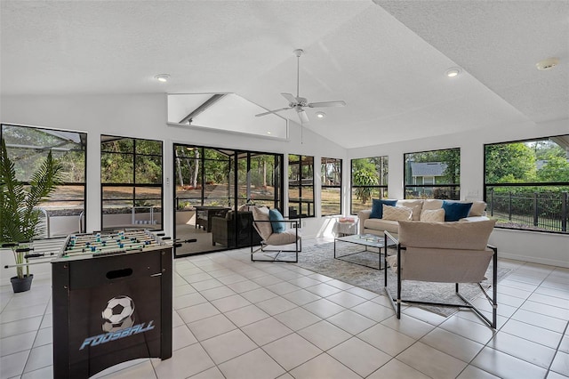 sunroom with recessed lighting, vaulted ceiling, a textured ceiling, and tile patterned floors