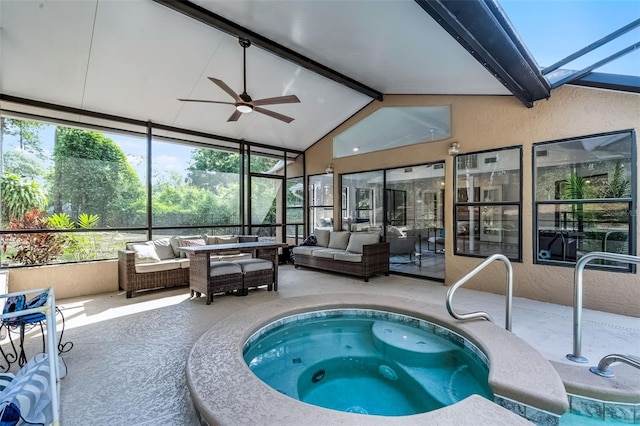 view of pool with glass enclosure, a patio area, ceiling fan, an in ground hot tub, and an outdoor living space