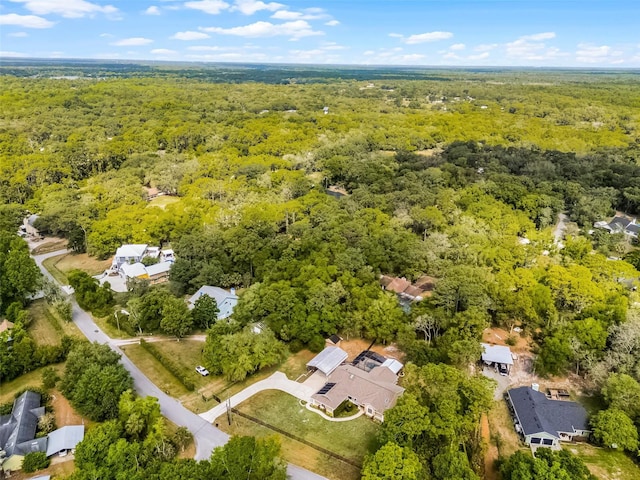 bird's eye view featuring a residential view and a forest view