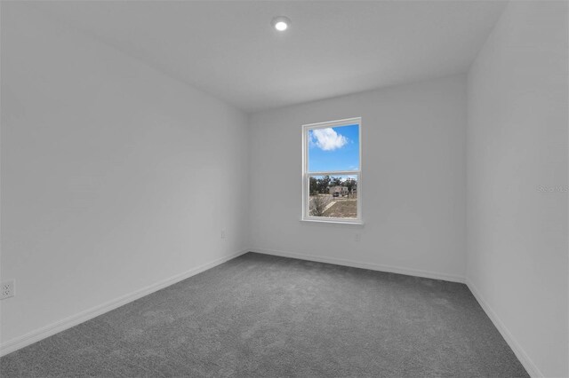 carpeted spare room with baseboards and recessed lighting
