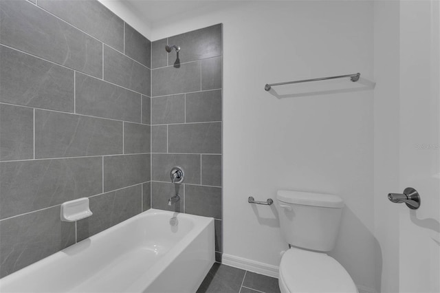 bathroom featuring shower / bathtub combination, baseboards, toilet, and tile patterned flooring